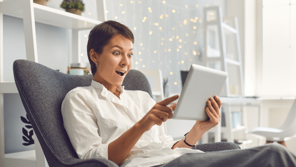 woman happily with her ipad